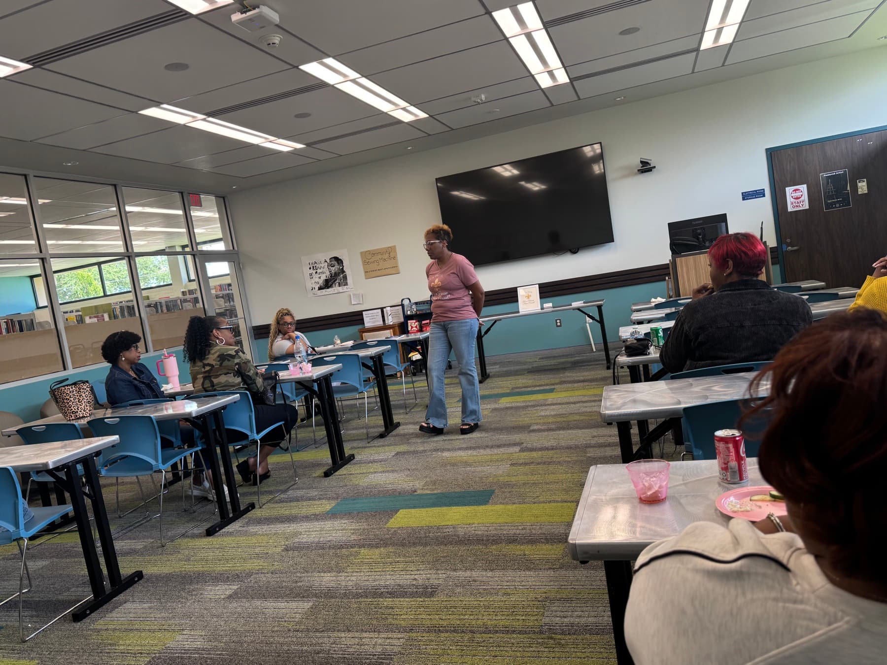 Wide view of the Founder facilitating IPNP’s first meeting with participants seated around the room