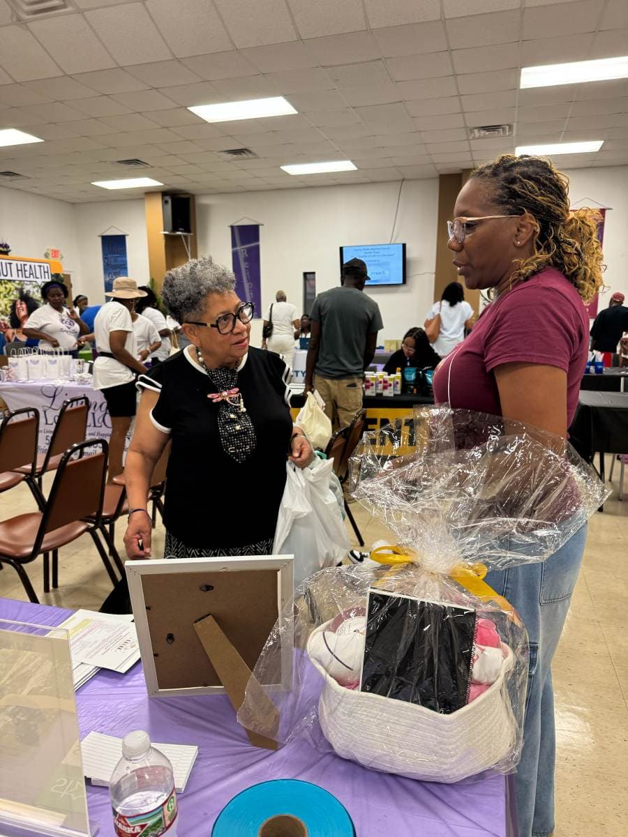 IPNP founder connecting with a guest at the Living Water Baptist Church Health Expo
