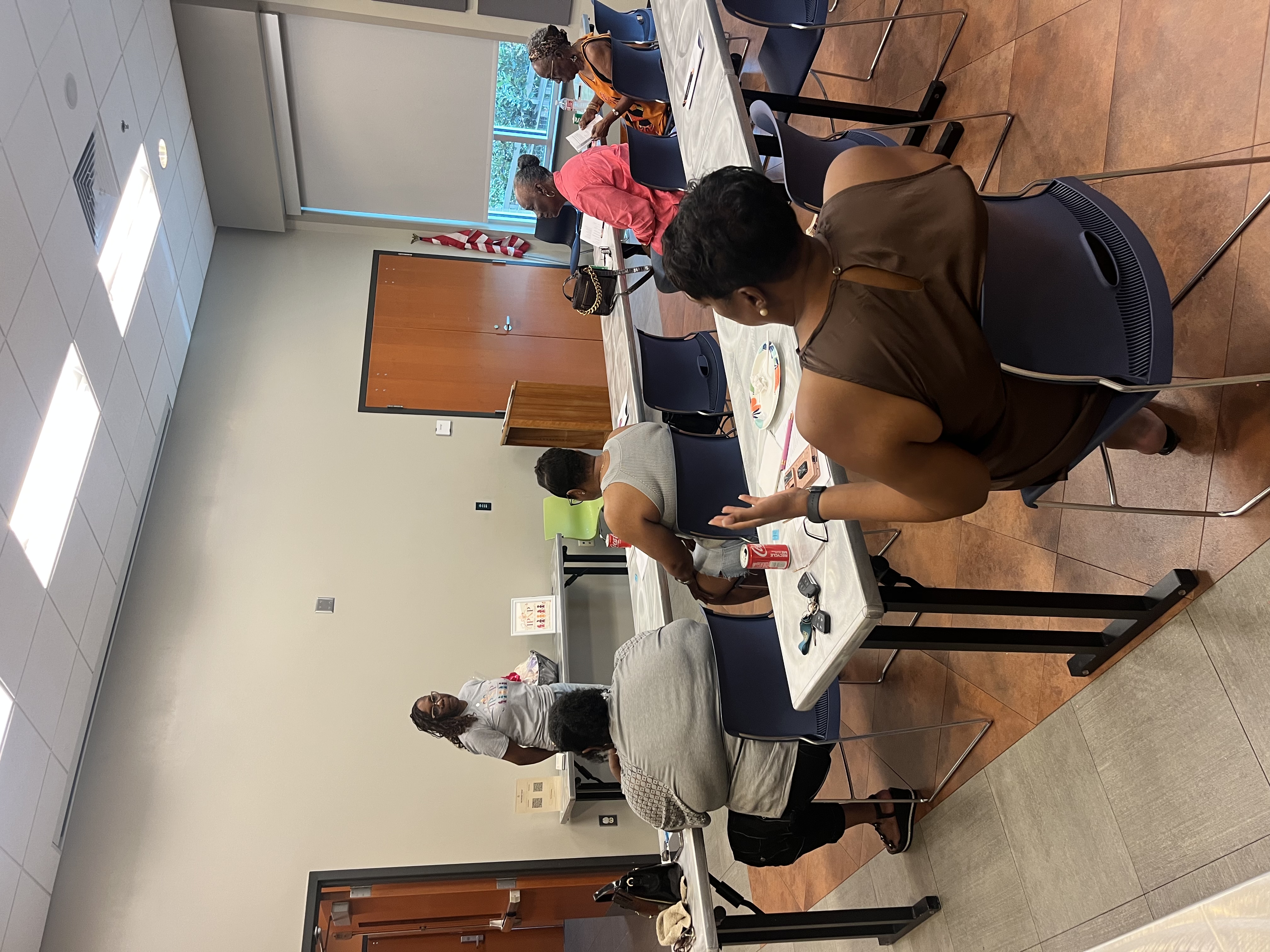 Houma meeting attendees participating in the conversation, including an attendee with a raised hand